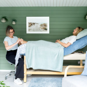 Helen McDonald with a client in the treatment room.